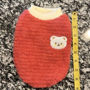 2 pieces bundle. Dog pink and coral sweaters size Sm. Up to 4lb.
